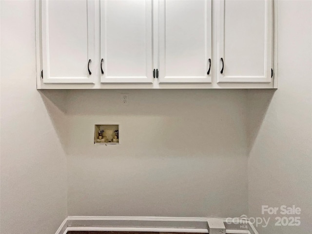 laundry room with baseboards, cabinet space, and hookup for a washing machine