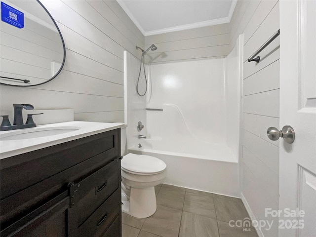 bathroom featuring vanity, ornamental molding, tile patterned flooring, toilet, and shower / bathtub combination