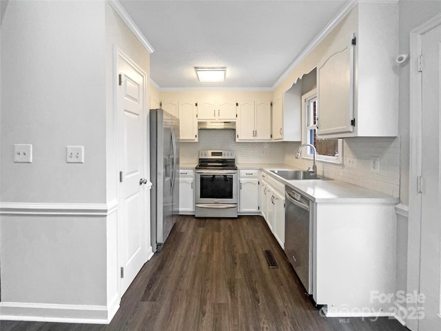 kitchen featuring visible vents, a sink, under cabinet range hood, appliances with stainless steel finishes, and light countertops