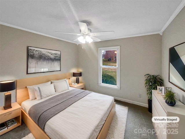 carpeted bedroom featuring baseboards, a ceiling fan, and crown molding