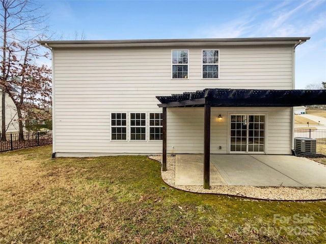 rear view of house featuring a patio area, central air condition unit, a yard, and fence