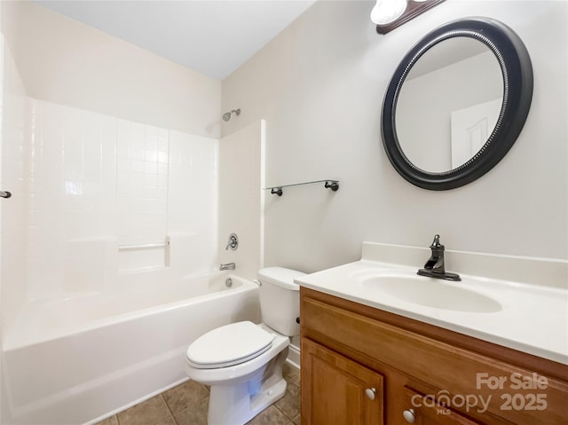 bathroom with tile patterned flooring, toilet, vanity, and bathtub / shower combination