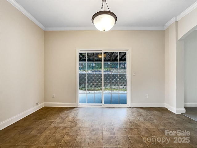 unfurnished room featuring baseboards and ornamental molding