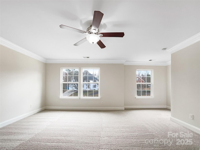 empty room with visible vents, ceiling fan, baseboards, ornamental molding, and light carpet