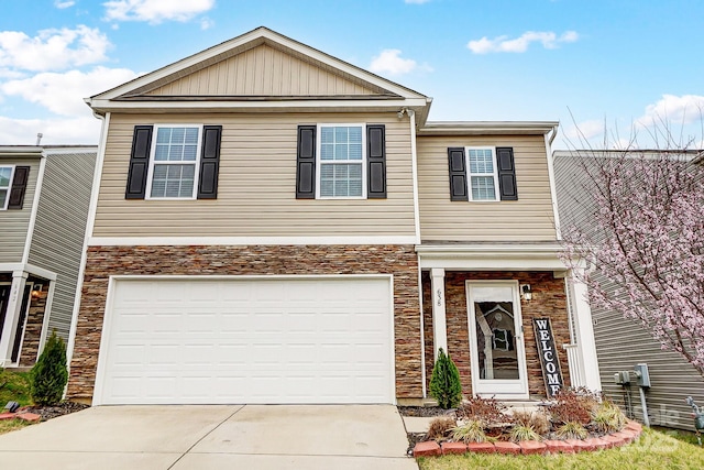 view of front of home with a garage, stone siding, and concrete driveway