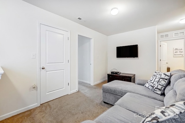 living room with baseboards, visible vents, and carpet floors