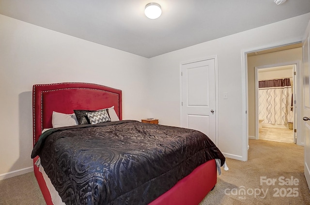 carpeted bedroom featuring baseboards