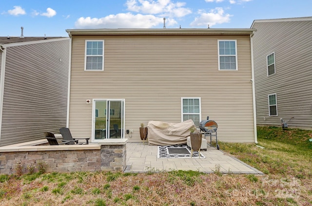 back of property featuring a patio