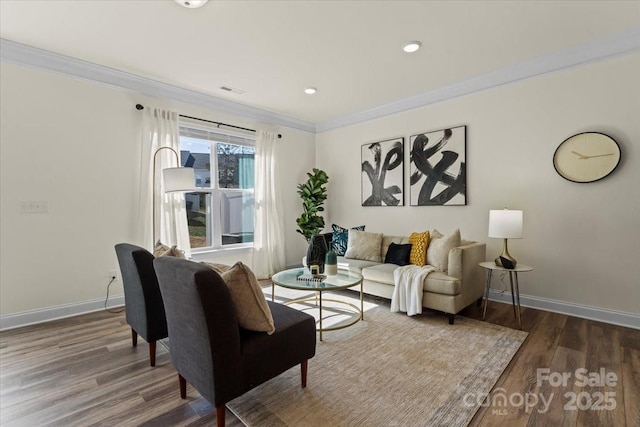 living room with visible vents, wood finished floors, recessed lighting, crown molding, and baseboards