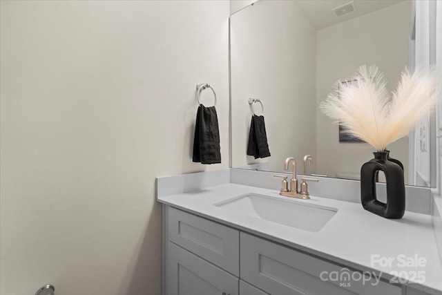 bathroom with visible vents and vanity