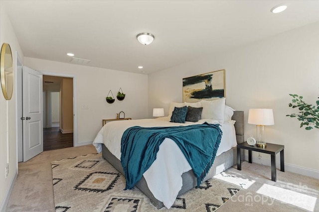 carpeted bedroom featuring recessed lighting and baseboards