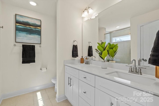 full bathroom featuring a shower stall, toilet, tile patterned floors, and a sink