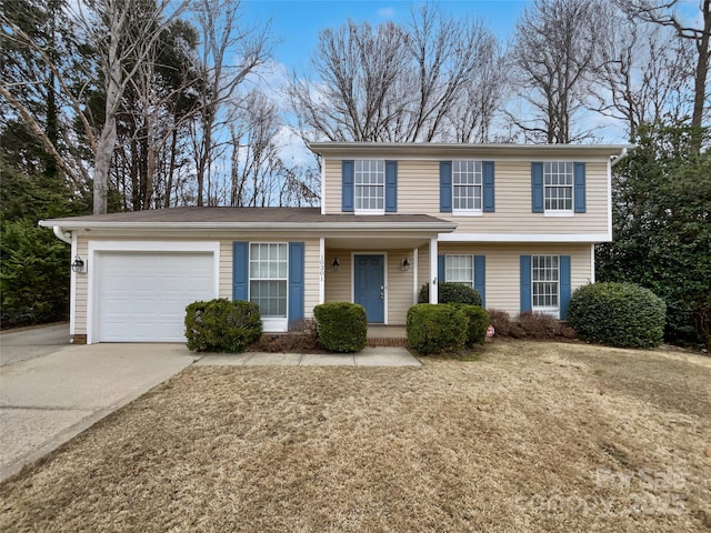 view of front of home with a garage and driveway