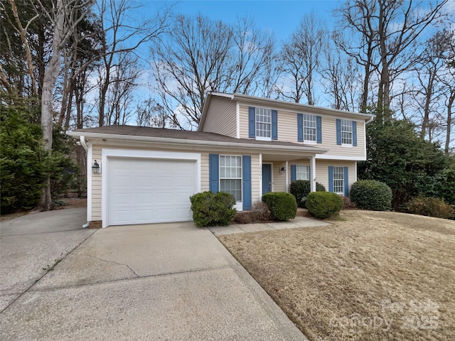 view of front of property with concrete driveway and an attached garage