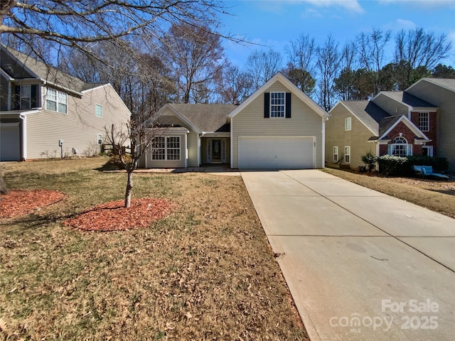 traditional home with concrete driveway, a garage, and a front yard