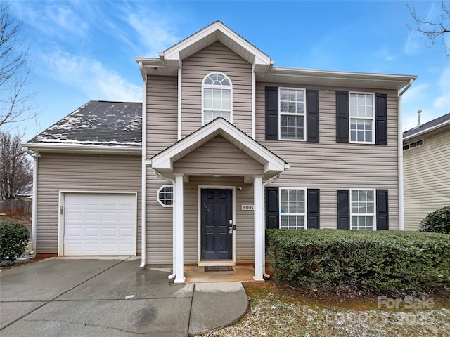 view of front of home featuring driveway and a garage