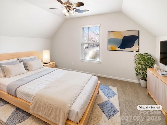 bedroom featuring visible vents, light colored carpet, baseboards, and vaulted ceiling