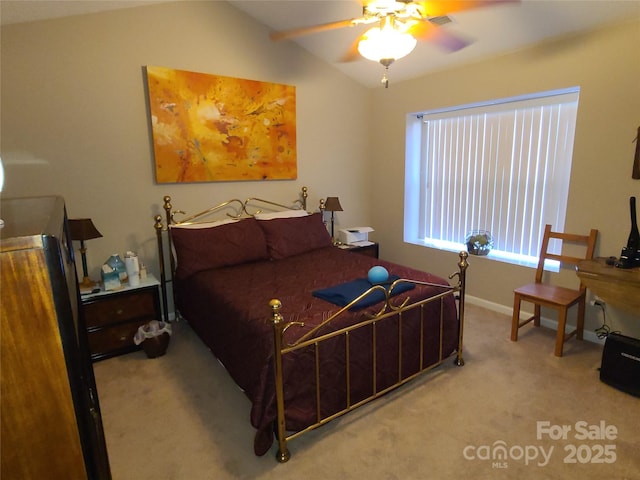 carpeted bedroom featuring visible vents, baseboards, and lofted ceiling