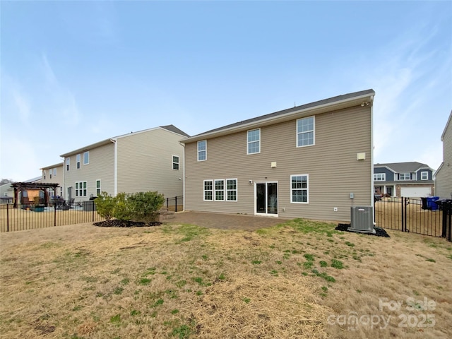 rear view of property with a patio, central AC unit, and fence