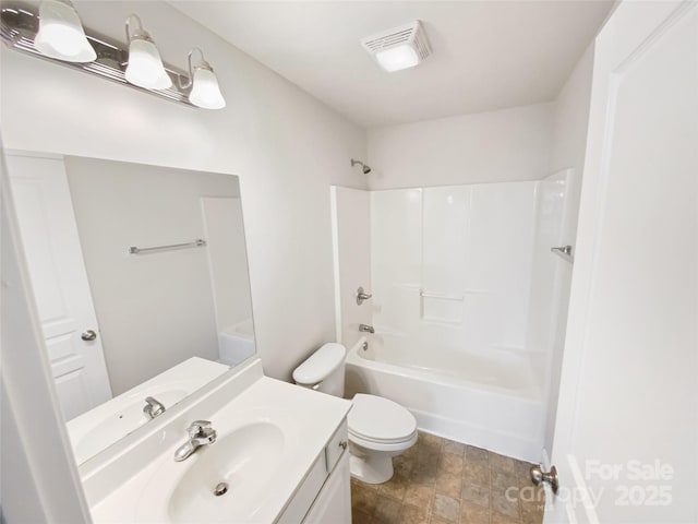 full bathroom with visible vents, toilet, vanity, and shower / tub combination