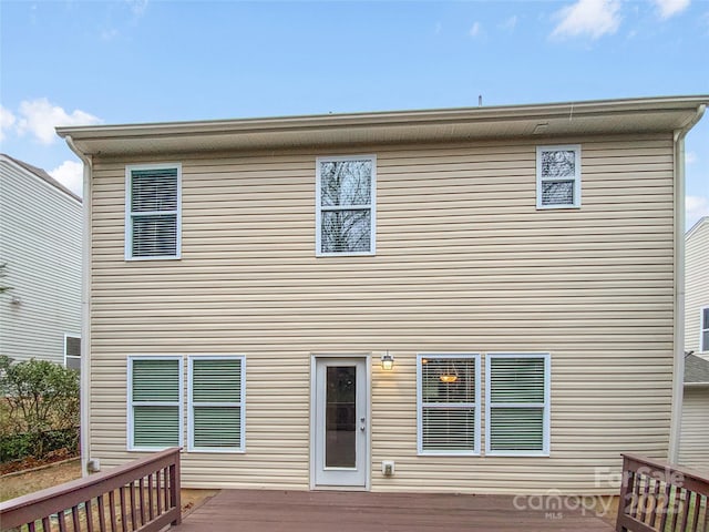 back of house featuring a deck