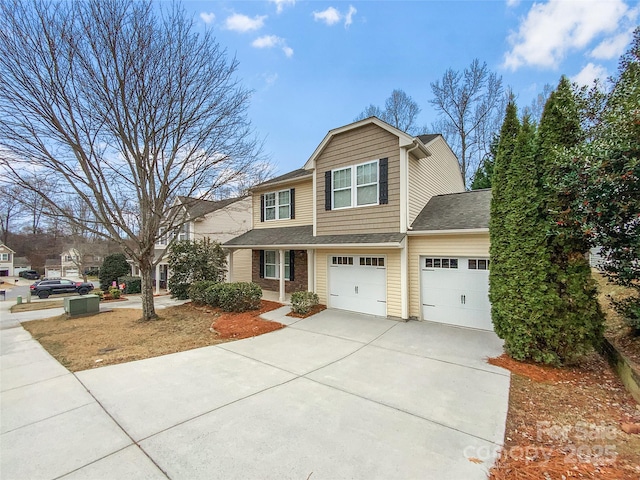 view of front of house featuring an attached garage, brick siding, and driveway