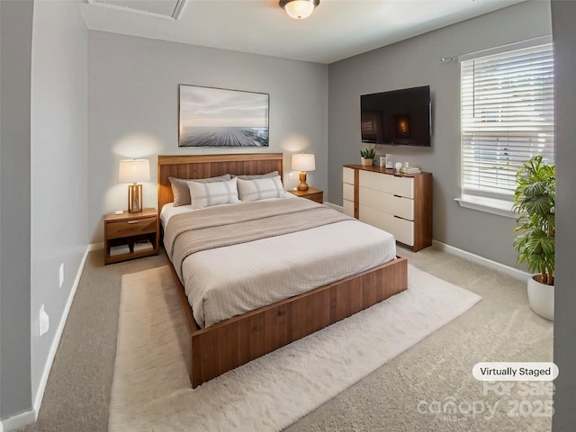 carpeted bedroom with baseboards