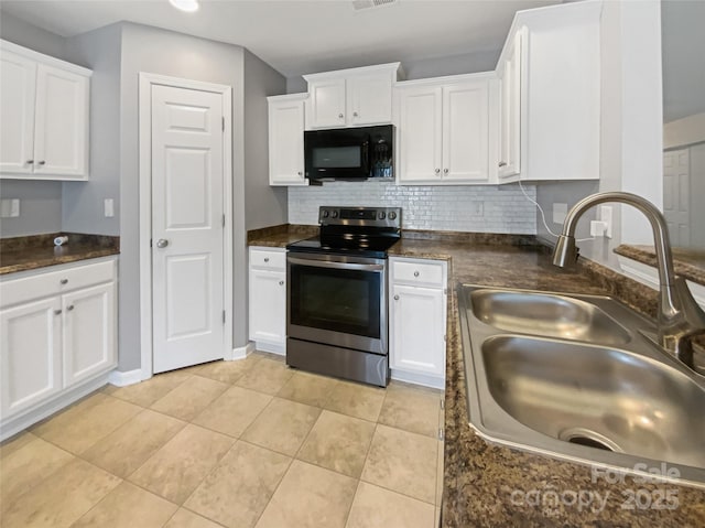 kitchen featuring stainless steel range with electric stovetop, a sink, dark countertops, white cabinetry, and black microwave