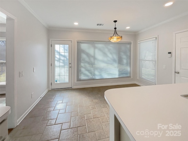 unfurnished dining area featuring visible vents, ornamental molding, stone finish flooring, recessed lighting, and baseboards