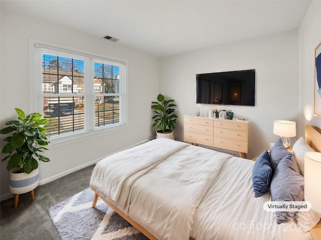 bedroom featuring visible vents, baseboards, and carpet flooring