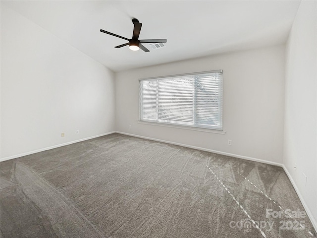 empty room featuring a ceiling fan, baseboards, visible vents, and carpet floors