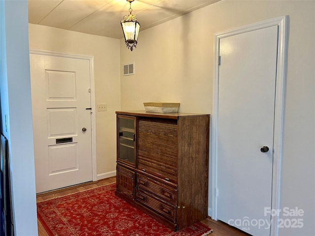 foyer featuring visible vents