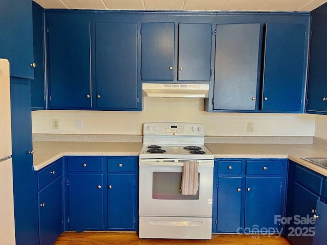 kitchen with blue cabinetry, under cabinet range hood, wood finished floors, white electric stove, and light countertops