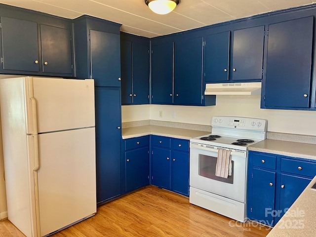 kitchen featuring white appliances, light wood-style flooring, light countertops, and under cabinet range hood