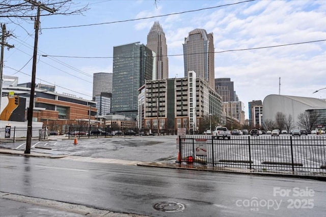 view of street featuring curbs, a view of city, and sidewalks