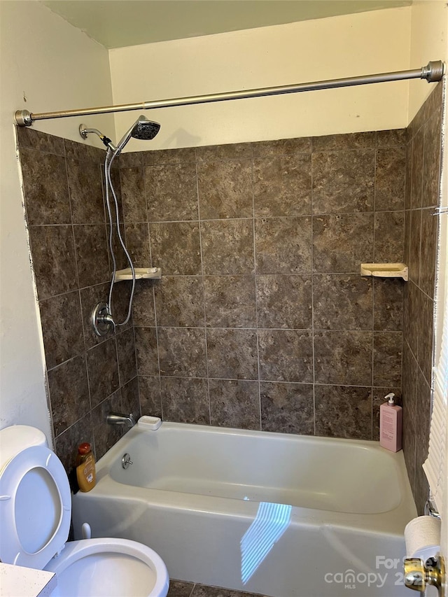 full bath featuring toilet and washtub / shower combination