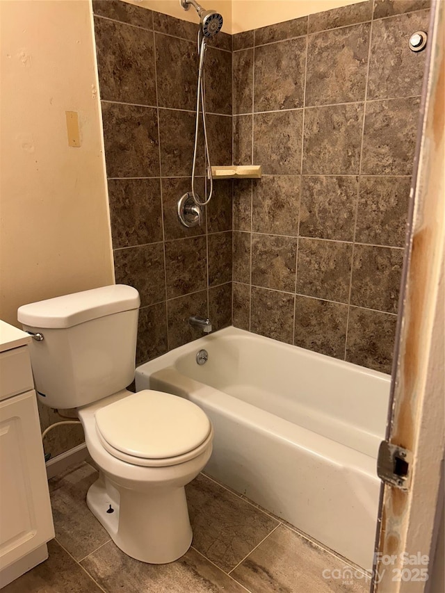 bathroom featuring vanity, shower / bathing tub combination, toilet, and tile patterned flooring