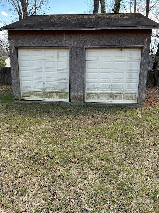 detached garage with fence