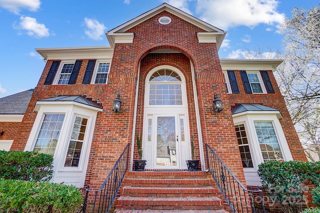 view of front of house featuring brick siding