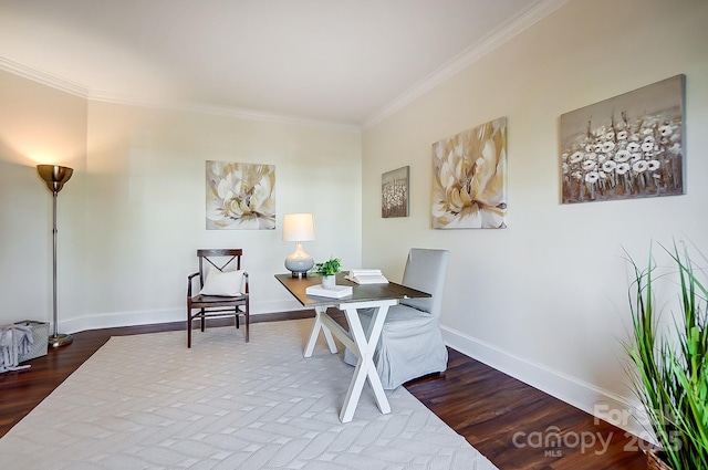 office space featuring wood finished floors, baseboards, and ornamental molding