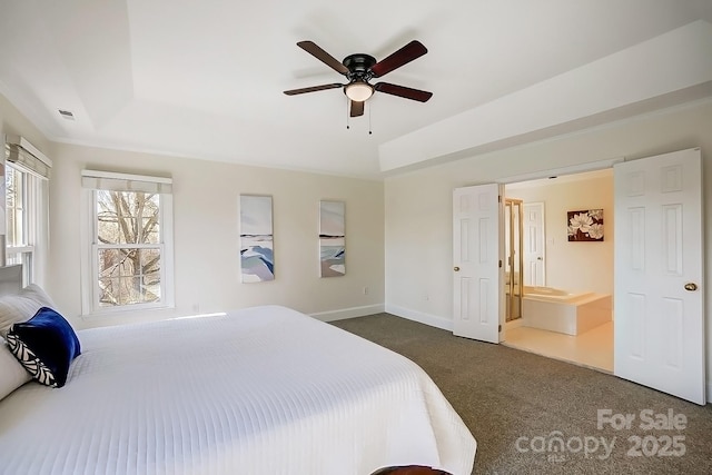 bedroom featuring baseboards, a raised ceiling, visible vents, and dark carpet