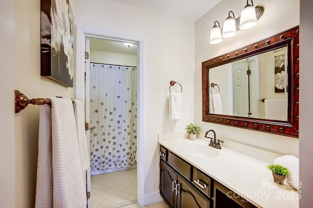 bathroom with tile patterned floors and vanity