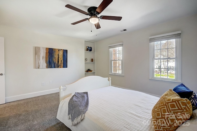 bedroom featuring visible vents, ceiling fan, baseboards, and carpet