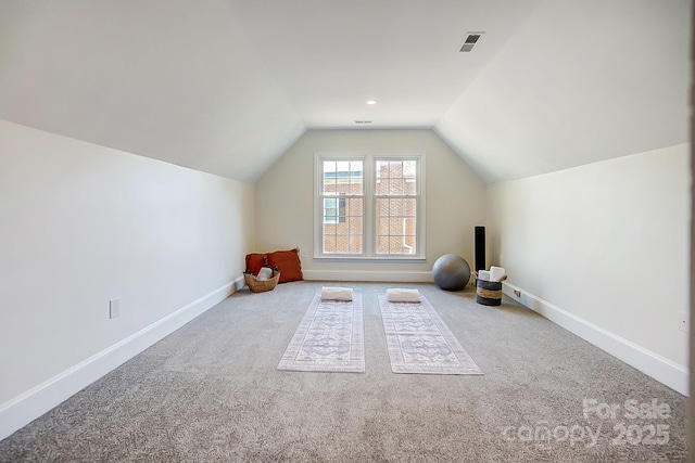 bonus room featuring lofted ceiling, carpet flooring, baseboards, and visible vents