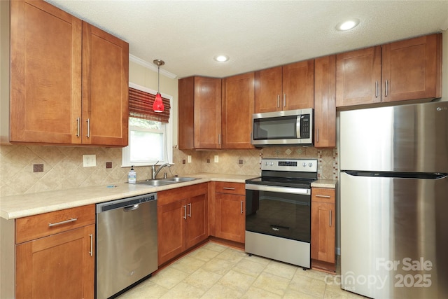 kitchen with appliances with stainless steel finishes, brown cabinetry, and light countertops