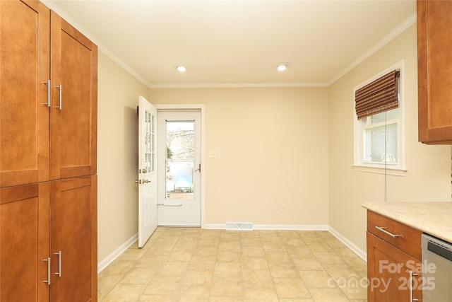 kitchen featuring visible vents, light countertops, baseboards, and stainless steel dishwasher