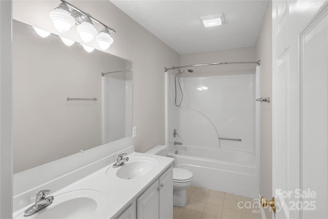 full bathroom featuring double vanity, toilet, shower / bathtub combination, and a sink