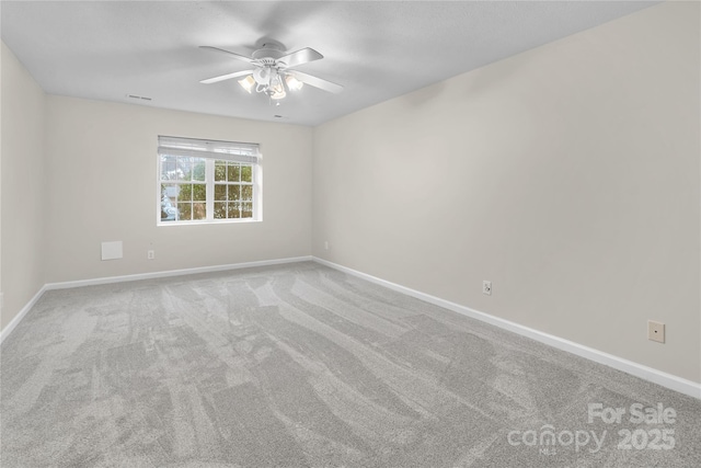 empty room with visible vents, ceiling fan, baseboards, and carpet floors