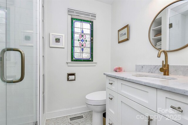 1817 Jameston Dr, Charlotte, NC 28209 - full bath featuring visible vents, toilet, a stall shower, and vanity