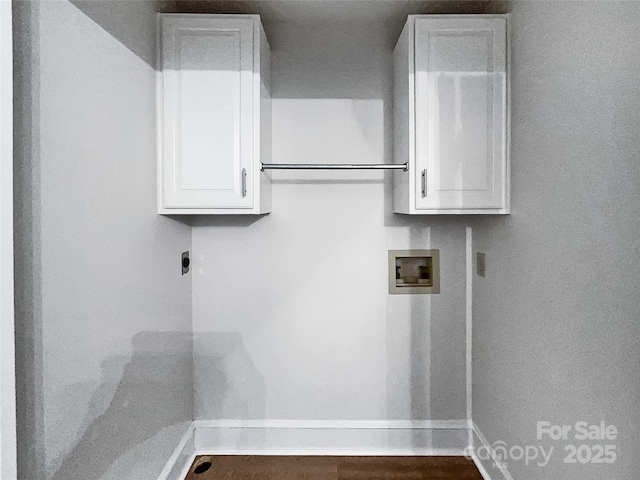 laundry room with hookup for a washing machine, wood finished floors, baseboards, hookup for an electric dryer, and cabinet space